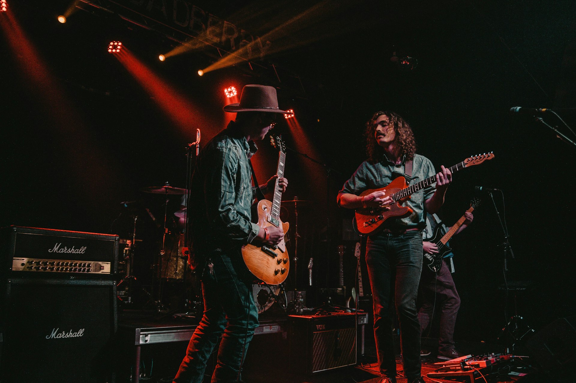 group of men playing guitars